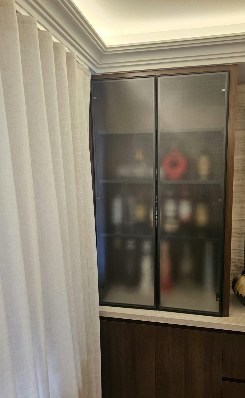 Second pair of black aluminum-framed doors with translucent decorative glass in a tall built-in cabinet at 135 East 83rd Street, Upper East Side