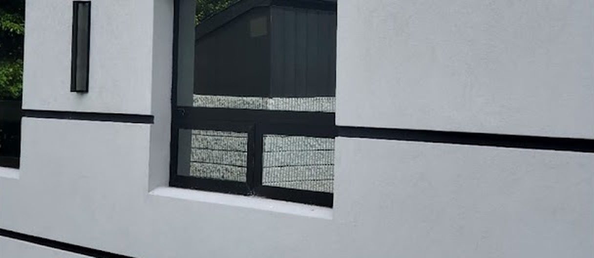 Dark-framed window in the exterior wall of the office building at 1545 Route 202, Pomona, NY