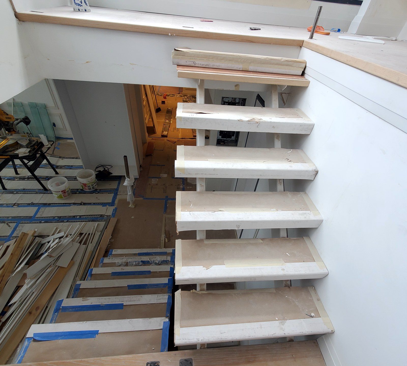 View down the open-riser stair before the glass railing was installed at 300 East 90th Street, Manhattan