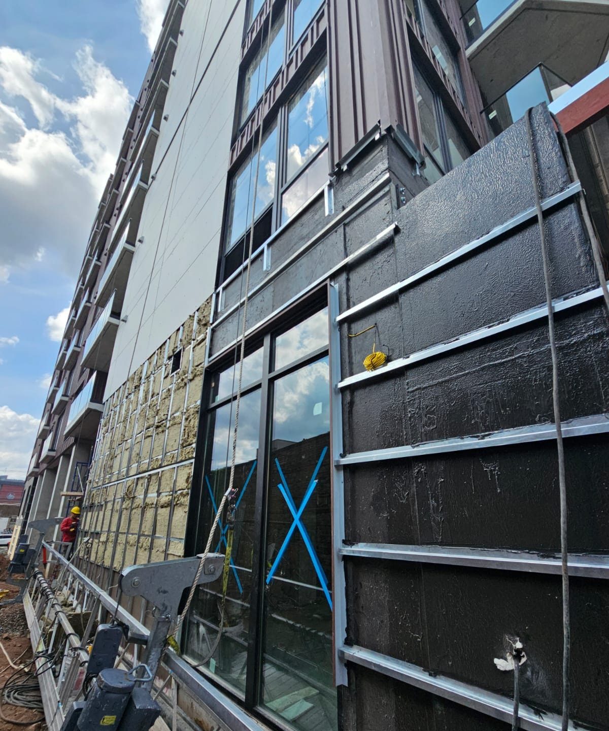 Side elevation of 66 McWhorter Street, Newark, with uPVC windows installed and exterior work in progress