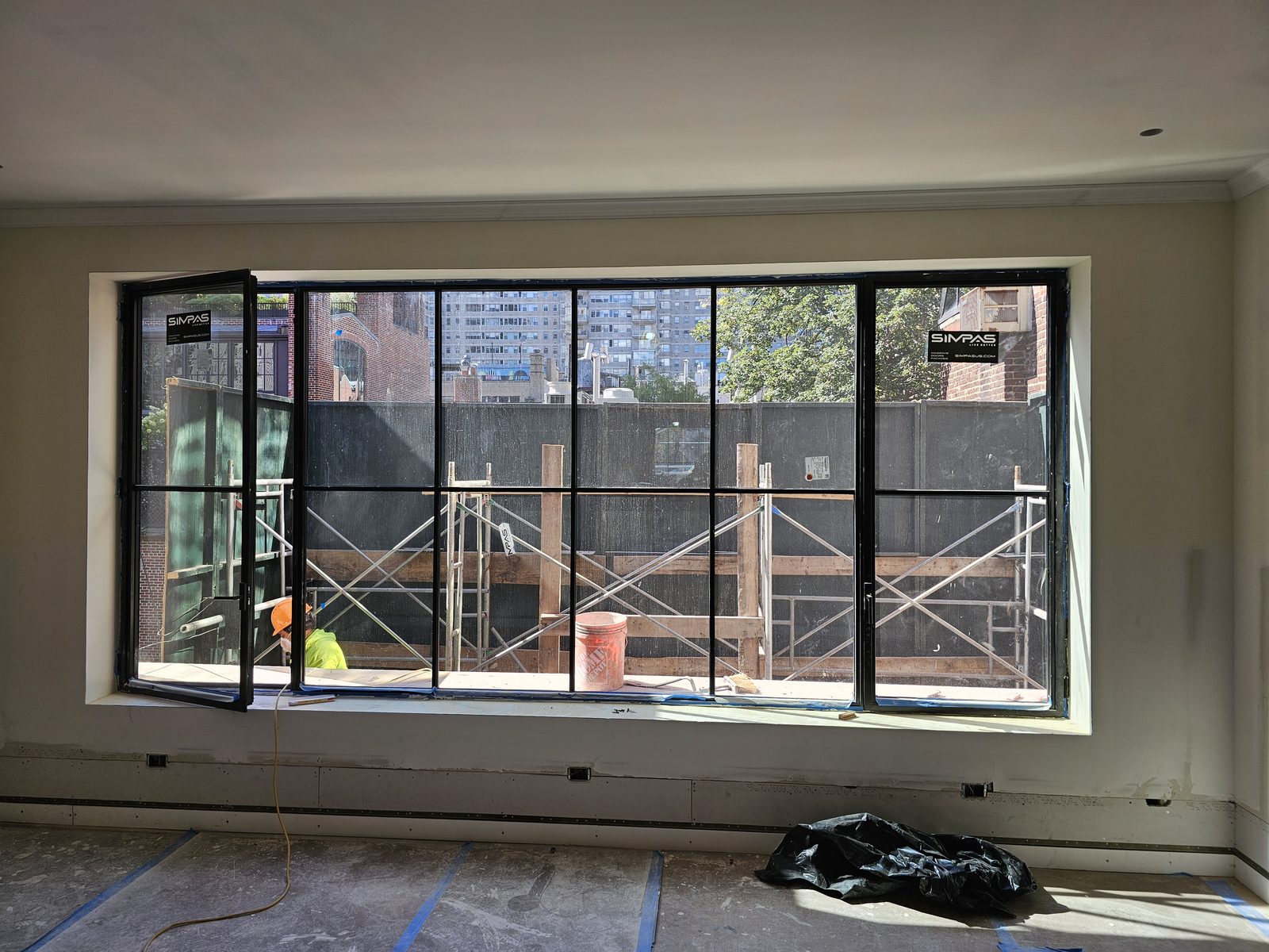 Black SIMPAS window wall with one casement open, East 71st Street Manhattan