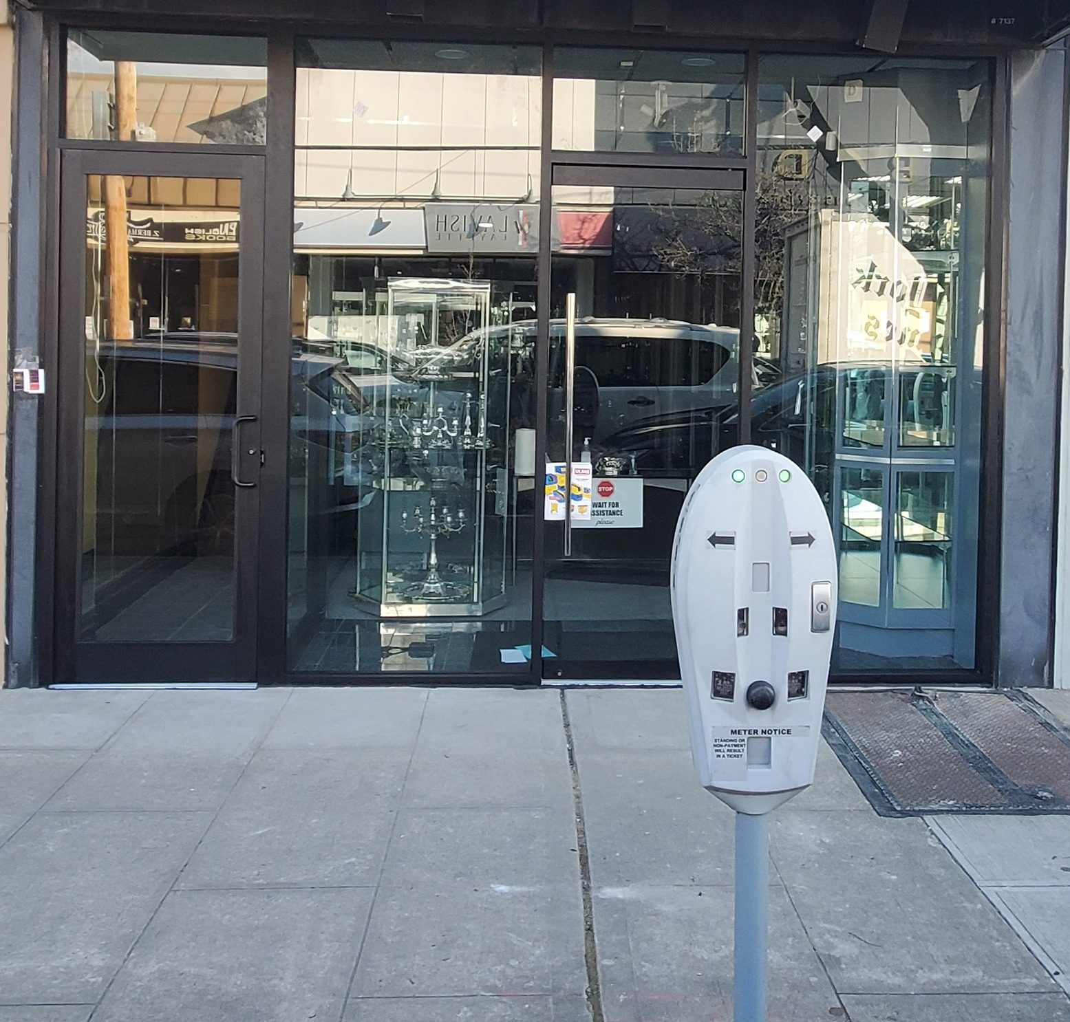 New black aluminum and glass storefront with two glass doors and transoms for a retail shop in Cedarhurst, NY