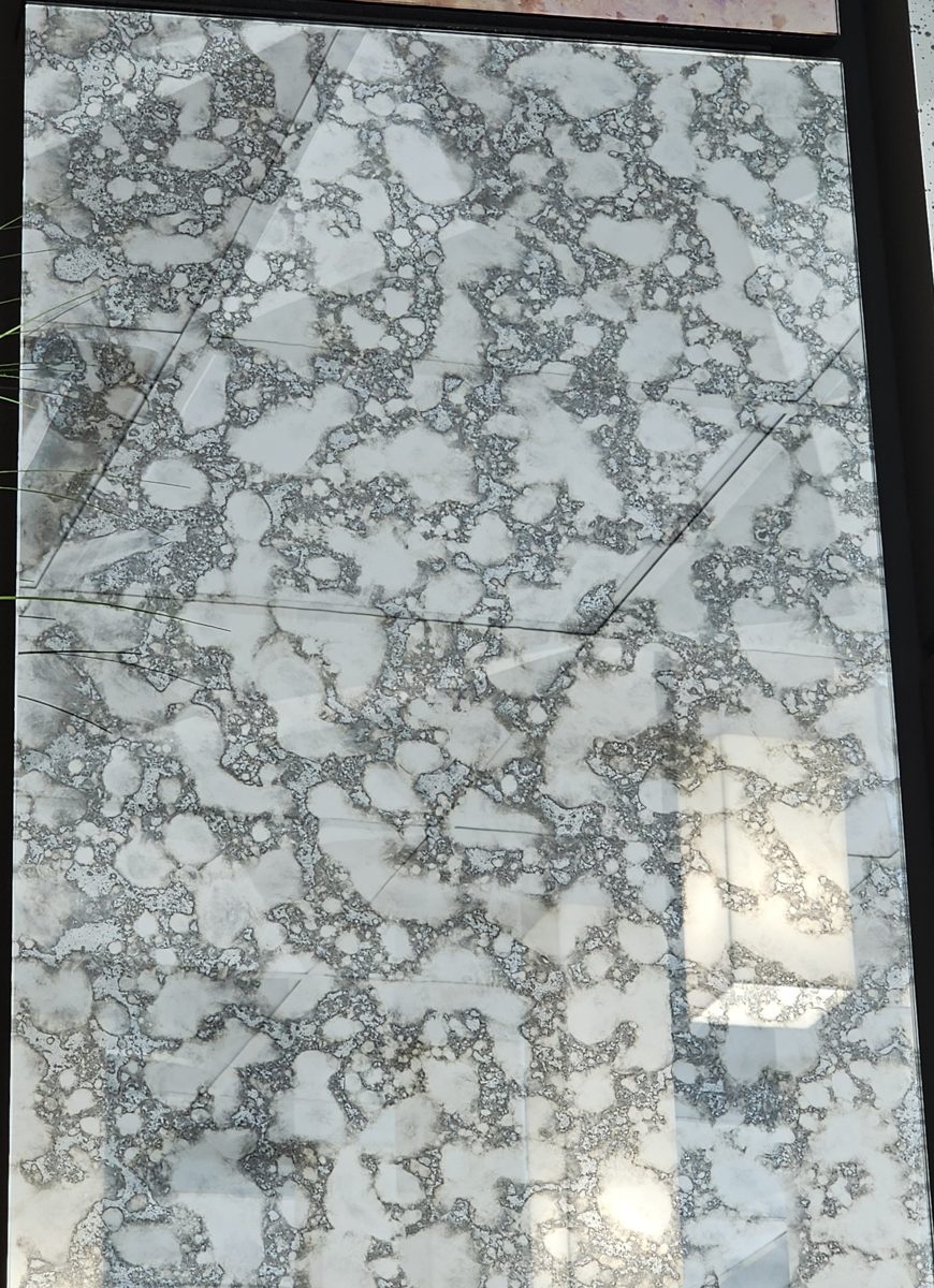 Sample of Dijon antique mirror: pale mirror patches separated by a dark gray mottled web