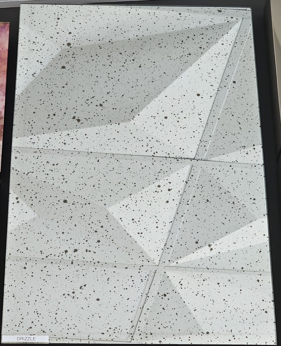 Sample of Drizzle antique mirror: silver mirror with scattered small dark specks