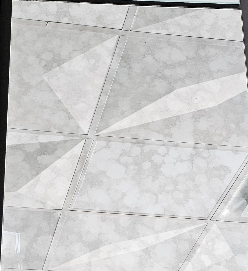Sample of Mirage antique mirror: bright silver mirror with a faint, cloud-like light gray mottling